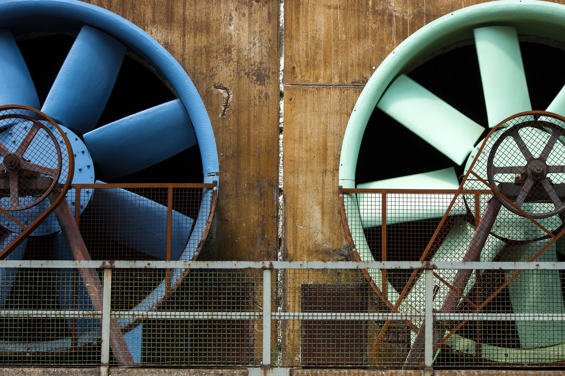 Large industrial ventilation fans in a factory setting